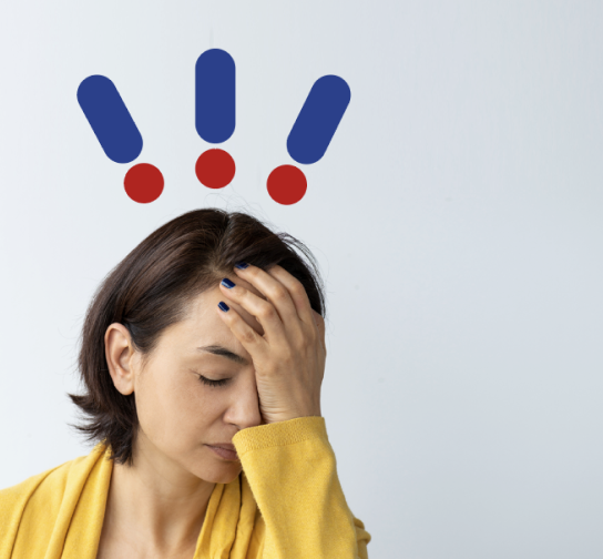 Woman with hand on head and expression of pain