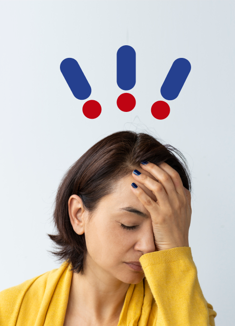 Woman with hand on head and expression of pain