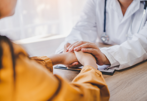 Doctor comforting patient